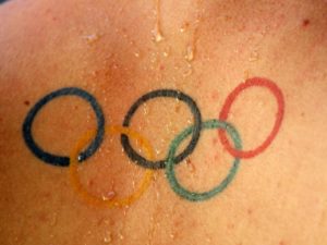 A tattoo of the Olympic rings logo is seen on the back of Hungary's Olympic hopeful Gergo Kis during the Hungarian Swimming Championship in Budapest July 11, 2008. REUTERS/Laszlo Balogh